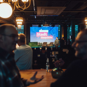 Adult Electronics Glasses Indoors Lighting Male Man Night Life People Person Screen Urban